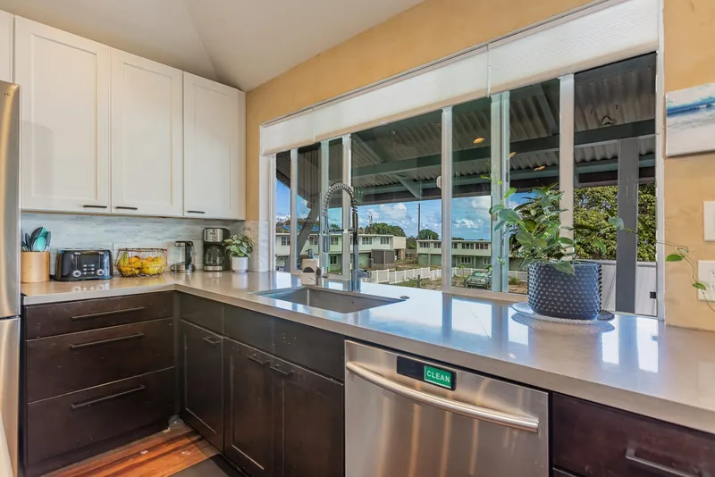 Kitchen is fully equipped for meals cooked at home — Historic 2BR Condo, Wailuku