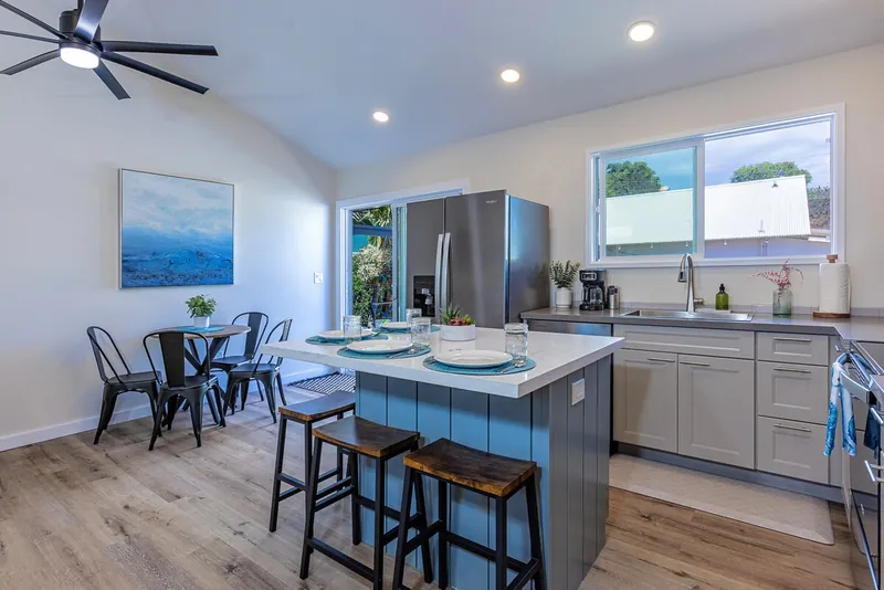 Seat Up to 8 Inside Via the Table and Barstools — Modern 3BR Home, Wailuku