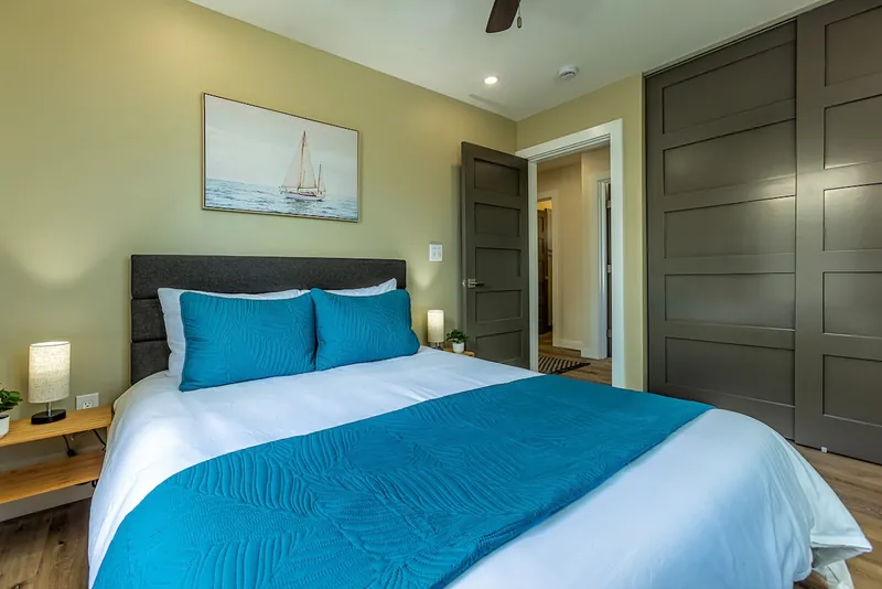 1 of 3 Bedrooms: Queen Bed, Ceiling Fan and AC — Modern 3BR Home, Wailuku